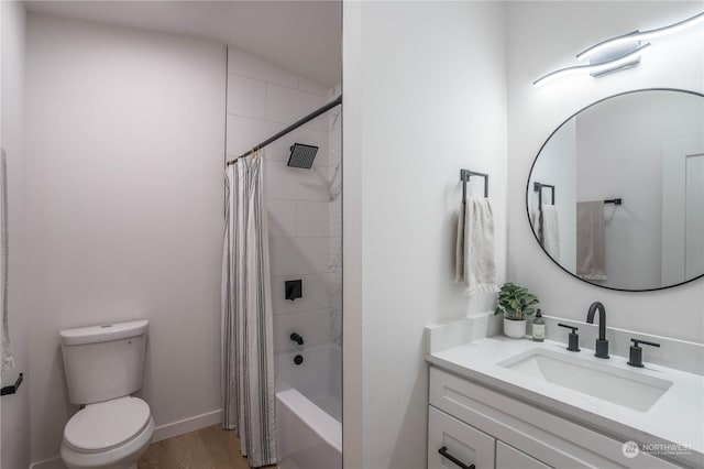 full bathroom featuring hardwood / wood-style flooring, vanity, shower / tub combo, and toilet