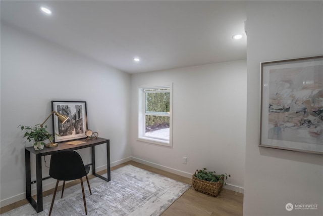 office with light hardwood / wood-style floors