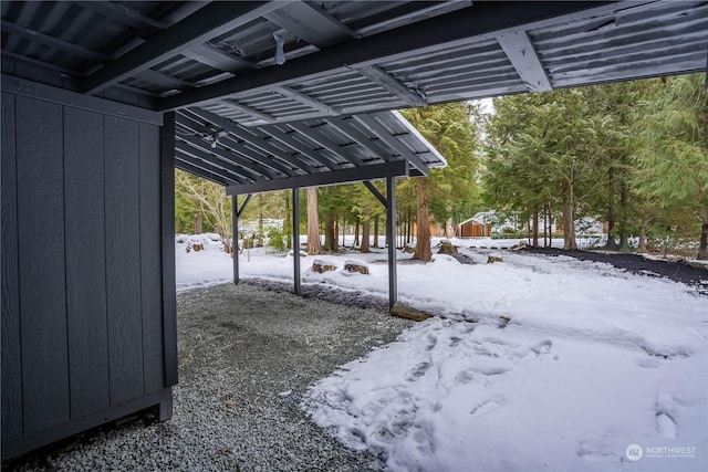 view of snow covered parking