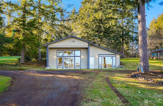 view of outbuilding with a yard