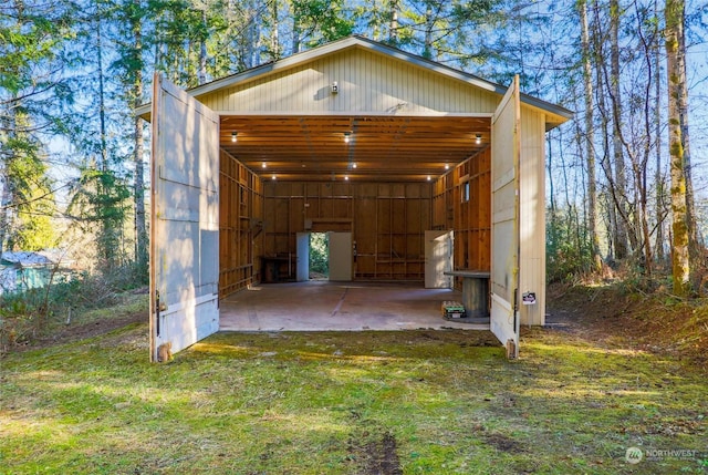 view of outbuilding with a lawn