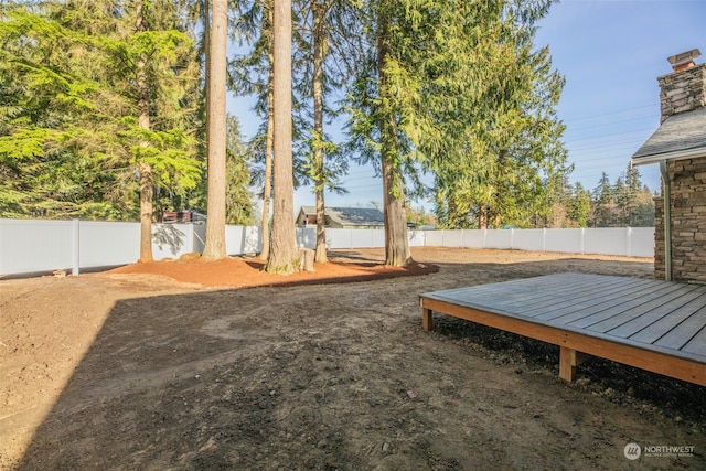 view of yard with a wooden deck