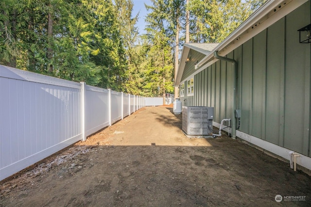 view of yard with central AC unit