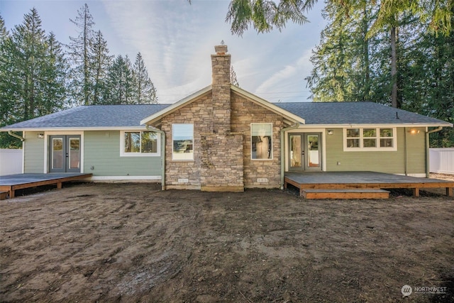 back of property featuring french doors and a deck