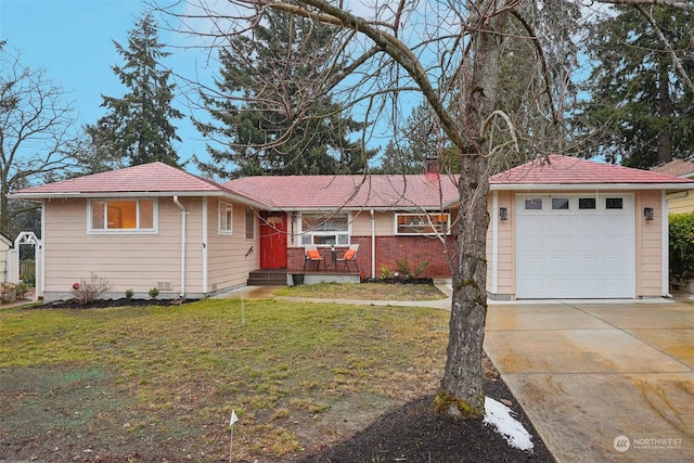 single story home with a garage and a front lawn