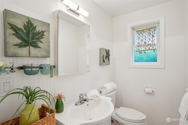 bathroom with toilet and sink