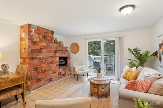 living room featuring a brick fireplace