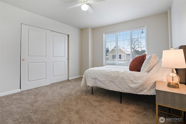 carpeted bedroom featuring a ceiling fan and baseboards