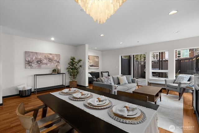 dining area featuring plenty of natural light, wood finished floors, and recessed lighting