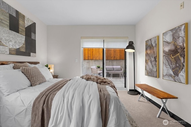 bedroom featuring carpet and access to outside