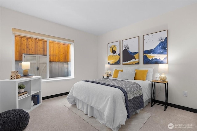 bedroom featuring carpet flooring and baseboards