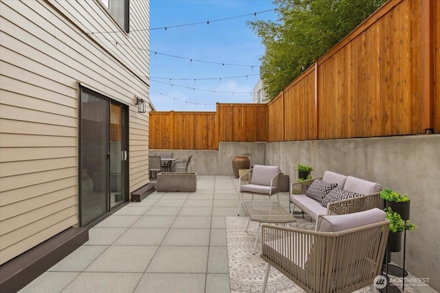 view of patio with an outdoor hangout area and a fenced backyard