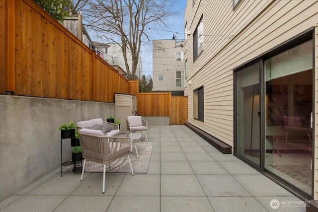 view of patio / terrace featuring a fenced backyard and an outdoor living space