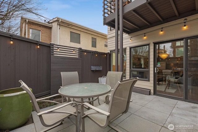 view of patio / terrace featuring outdoor dining space and fence