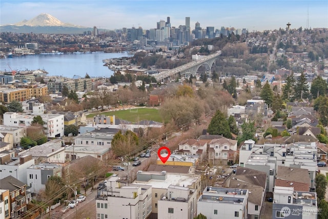 bird's eye view featuring a water view and a city view