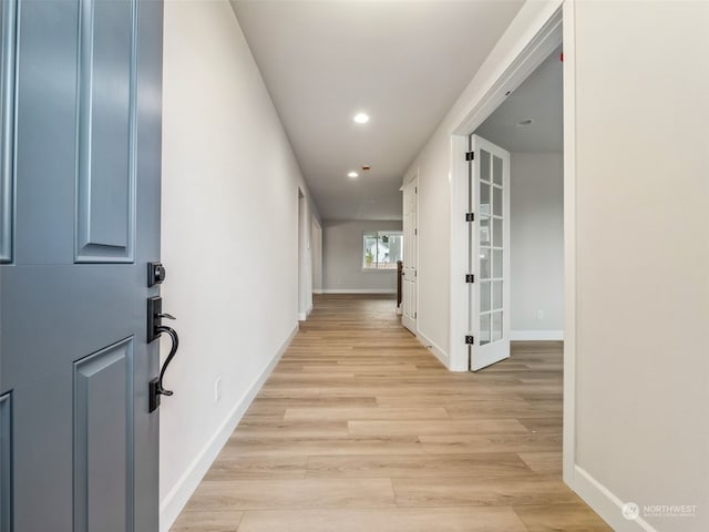 hall with light hardwood / wood-style floors