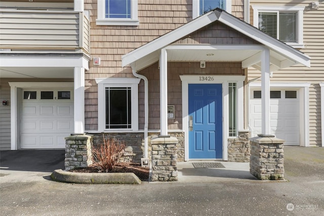 view of exterior entry featuring a garage