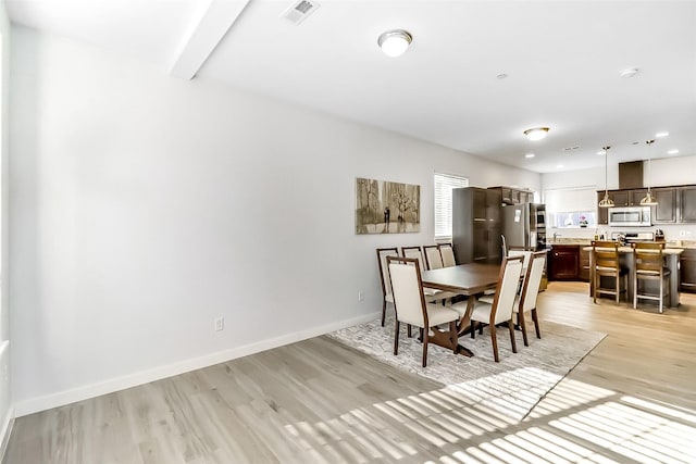 dining room featuring light hardwood / wood-style flooring