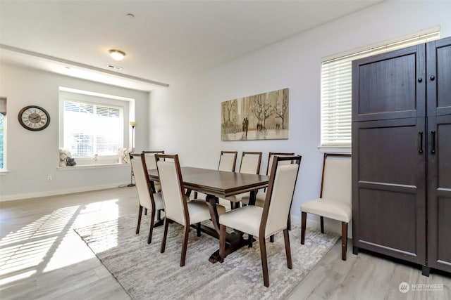 dining room with light hardwood / wood-style flooring