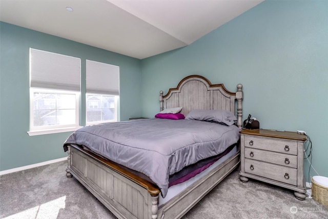 bedroom featuring light carpet