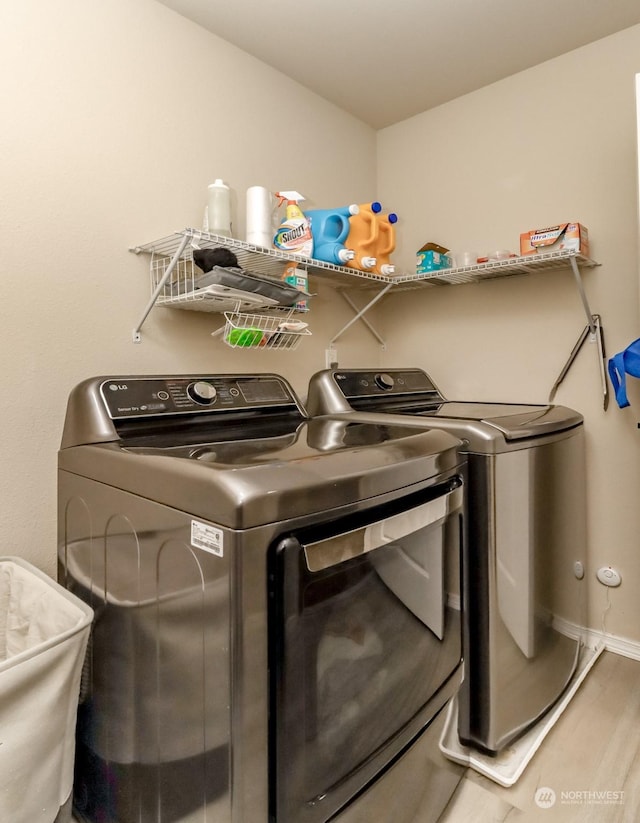 clothes washing area featuring washing machine and dryer