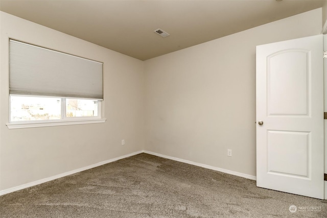 view of carpeted spare room