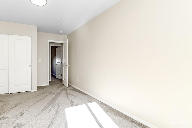 unfurnished bedroom with light carpet