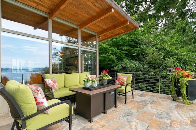 view of patio featuring an outdoor living space and a water view