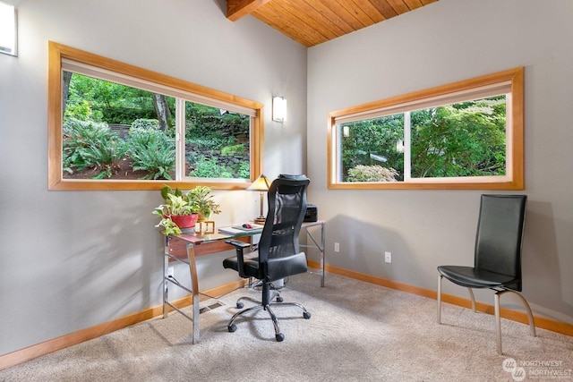 office space with beam ceiling, wooden ceiling, and carpet