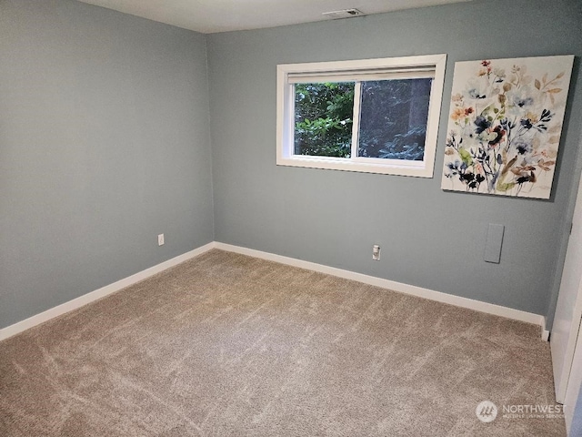 spare room with carpet flooring