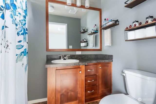 bathroom with vanity and toilet