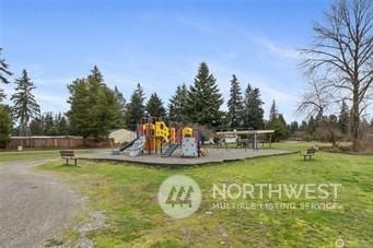 view of playground with a yard