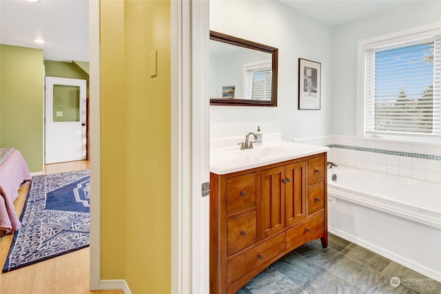 bathroom featuring vanity and a bathtub