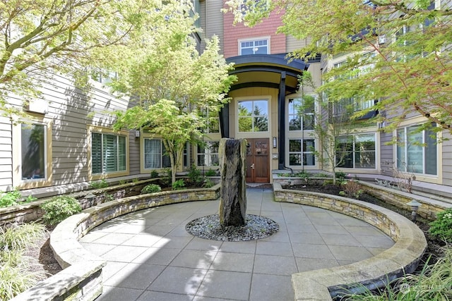 property entrance featuring a patio area