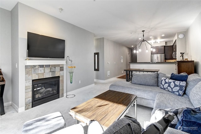 living room with light carpet and a fireplace