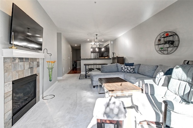 carpeted living room featuring a fireplace