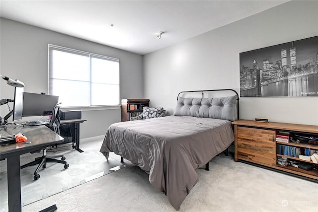 bedroom with light colored carpet