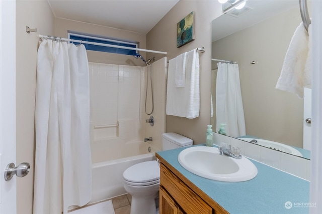 full bathroom featuring shower / tub combo with curtain, vanity, tile patterned flooring, and toilet