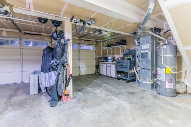 garage with heating unit and water heater