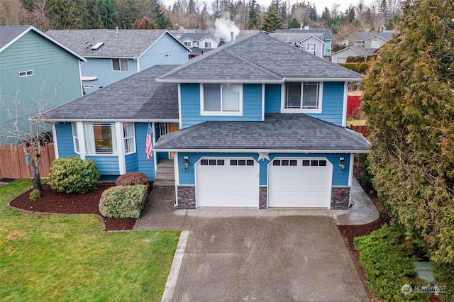 view of front facade featuring a garage and a front yard