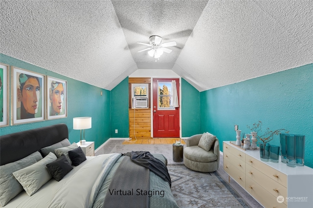 bedroom featuring lofted ceiling, cooling unit, a textured ceiling, and ceiling fan