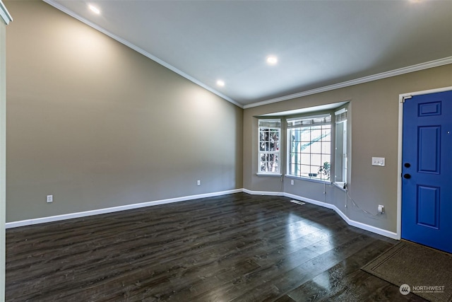 foyer entrance with dark wood-type flooring and ornamental molding