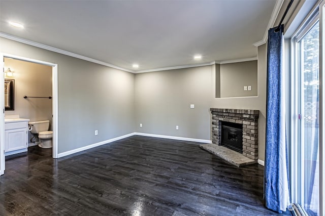 unfurnished living room with dark hardwood / wood-style flooring, ornamental molding, and a fireplace