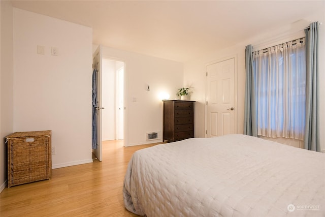 bedroom featuring light wood-type flooring