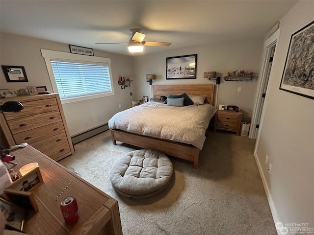 bedroom featuring baseboard heating, ceiling fan, and carpet