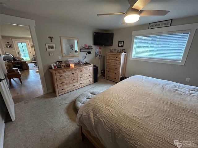 carpeted bedroom with ceiling fan