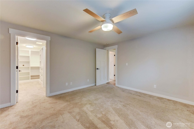 empty room featuring carpet floors and baseboards