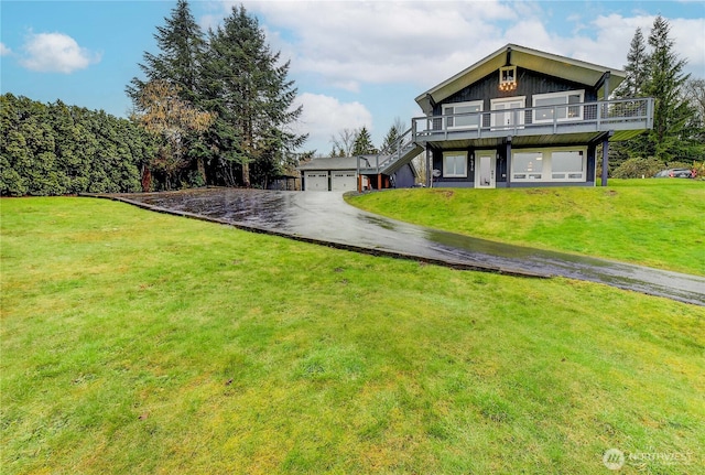 view of front of house with stairway, a deck, and a front yard