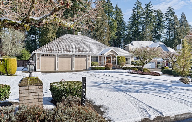 single story home with a garage