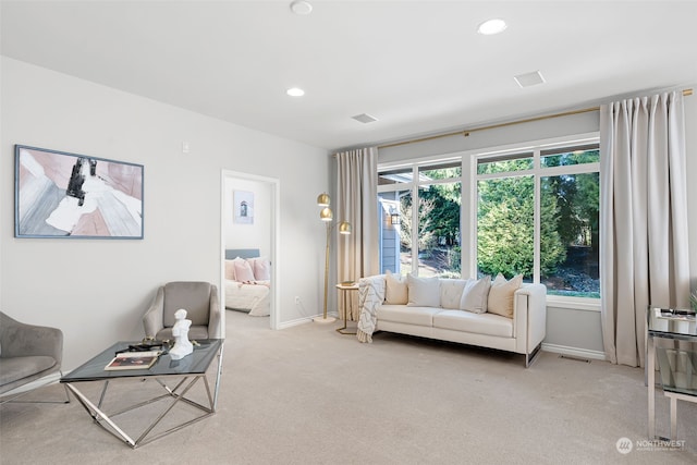 living room with light carpet and a wealth of natural light